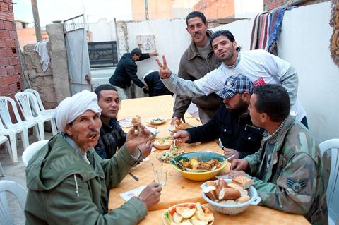 February 9: At Mohamed Bouazizi’s home on the 40th day after his death. Together with his immediate family—his mother, uncle, brother, and sisters—and friends from the neighborhood, a ceremony was held to mark the 40th day since Mohamed Bouazizi’s death. In Muslim culture, the 40th day is the day when the soul of the deceased leaves earth to enter paradise; it is also the day when relatives must accept the departure of their loved one—the day when the period of mourning is declared over. On this day, close relatives gather to eat at the home of the deceased’s family.