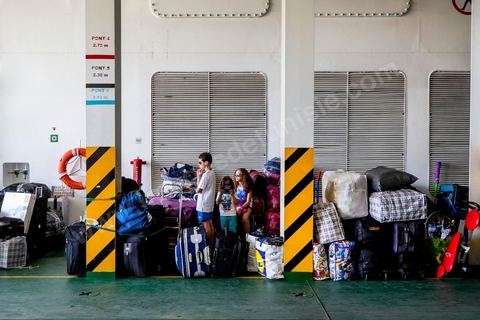 Loading of the overloaded vehicles and the passengers in the port of Marseille. Aboard the new vessel Tanit de la CTN (Tunisian Company of Navigation) going Marseille to Tunis. The return of the Tunisian immigrants in France every summer represents a tourist and financial basket very important for Tunisia. The number of Tunisians of the foreigner would be close to 1,5 millions that is 13 % of the Tunisian population, are 60 % to be lived in France and 82 % in Europe, The summer represents 55 % of the 1,75 million Tunisians' annual entrances of the foreigner.