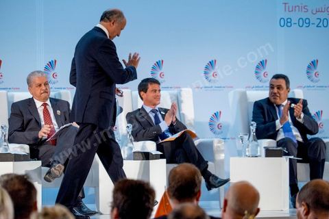 08 septembre 2014 : discours de Laurent Fabius, Ministre des Affaires étrangères français, assis le Premier ministre français Manuel Valls et son homologue algérien Abdelmalek Sallel (G) et tunisien Mehdi Jomaa (D) lors de l'ouverture de à la  Conférence "Investir en Tunisie, start up democracy" organisé apr la Tunisie et la France avec la présence de nombreux pays. La Tunisie présente, au cours de cette conférence, 20 projets structurants d’investissement dans plusieurs secteurs à l’instar des nouvelles technologies, des énergies renouvelables, de l’industrie, du tourisme et du commerce.