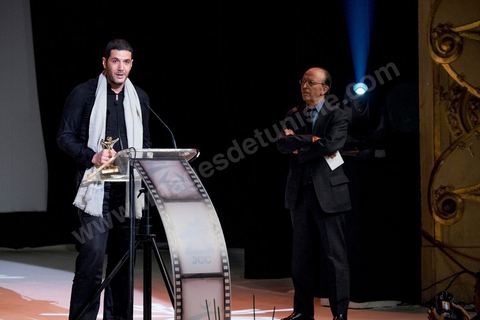 28 novembre 2015 : Prix du Jury à Nabil AYouch, réalisateur marocain du film "Much Loved". Cérémonie de cloture des JCC au théâtre municipal de Tunis au coeur de la capitale meutrie il y a quelques jours à peine par une attaque suicide terroriste qui a fait 12 morts parmis les policiers de la garde présidentielle. La cérémonie avancée pour cause de couvre feu a été un moment d'hommage à la culture qui a su faire face à la terreur durant cette semaine et l'occasion de primée les artistes et réalisateur du monde arabo-africain. 