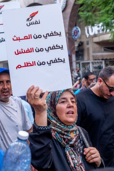 Tunis, Tunisia – August 20, 2026. Protesters march through downtown Tunis against President Kaïs Saïed, calling for his resignation and demanding greater political freedoms and the release of detainees and opposition figures. Portraits of the president crossed out with the slogan “GET OUT,” Tunisian flags, and signs accompany the protest. The protest comes amid growing social discontent following several weeks of extreme heat, water and power outages, and difficulties in accessing certain medications and essential goods.