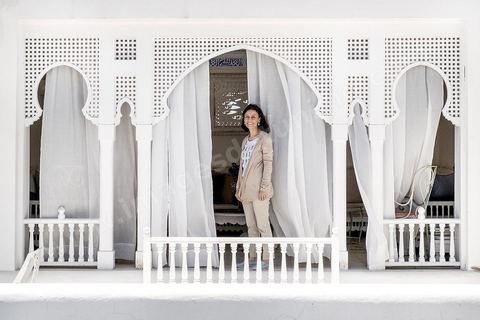 Leila Ben Gacem in the patio of the Dar Ben Gacem. This house was constructed in the 17th century, and was renovated from 2010 to 2013. Today it is a 7 room Boutique Hotel. Restoration work was lead by ASMTunis and decoration and furnishing shows the Tunisian traditional arts & crafts.